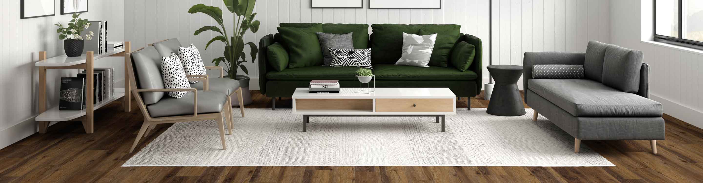 living room with hardwood floors covered by a cream area rug