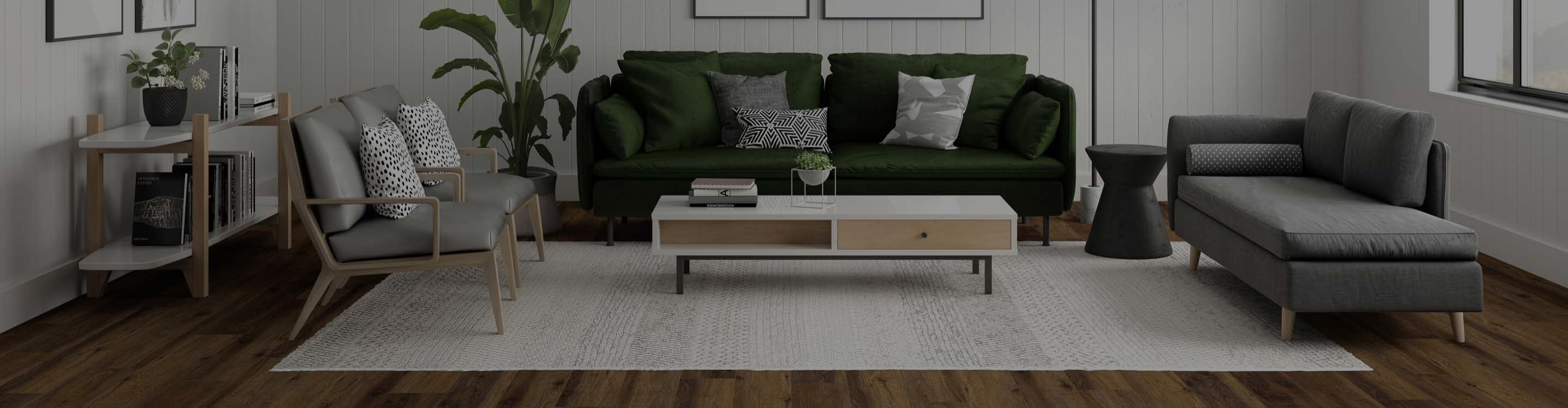 living room with hardwood floors covered by a cream area rug